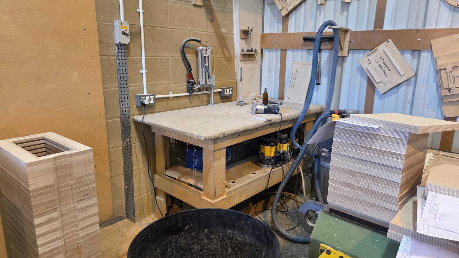 Adhesive and glue workbench used during precision speaker cabinet assembly.