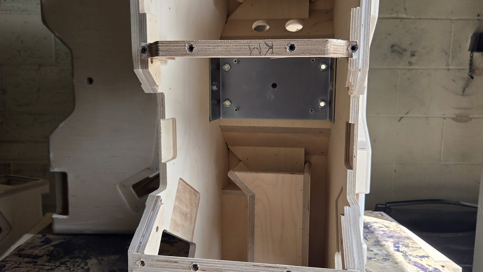 Internal bracing structure inside a Sarivale speaker cabinet, viewed from above.