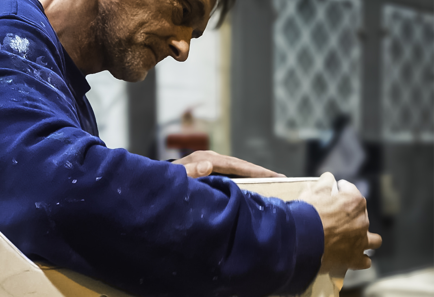 Close-up of hand-built cabinet assembly in the Sarivale workshop.