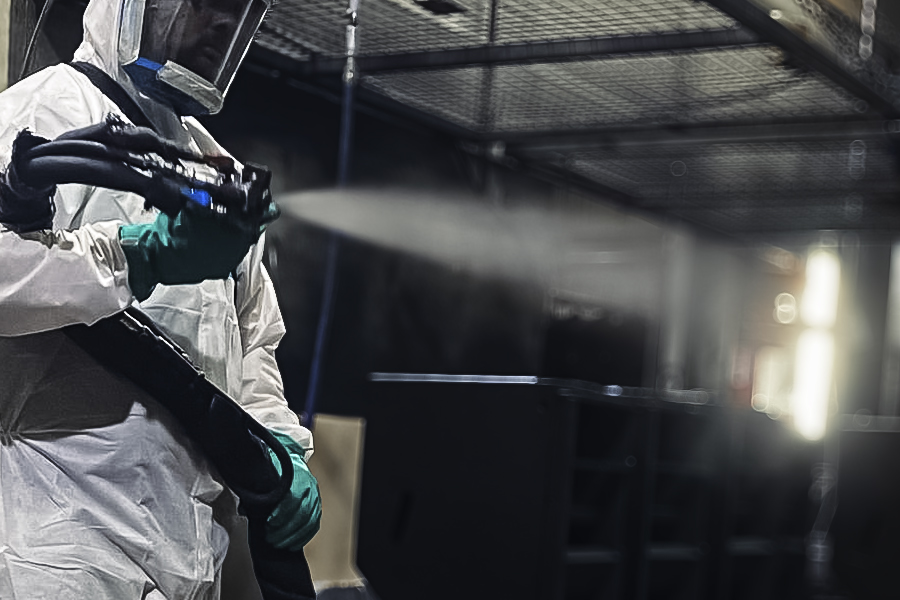Finishing materials being applied to a workshop surface.