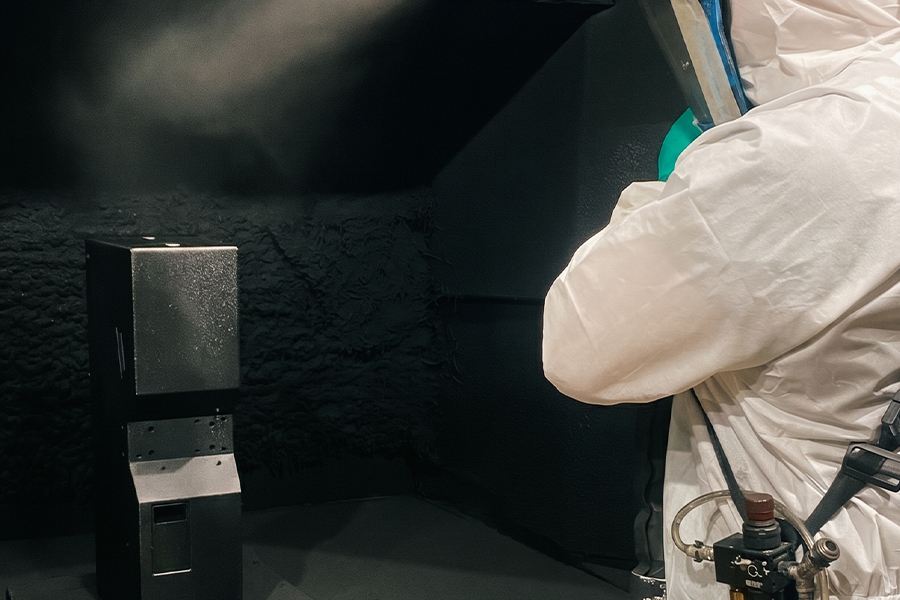 A Sarivale sprayer at work with a spray gun in the spray shop.